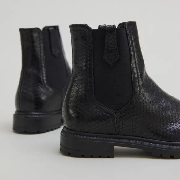 Boots à semelles crantées et élastiques