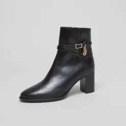 Boots à talons haut et charms dorés