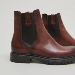 Bottines à semelles crantées et élastiques