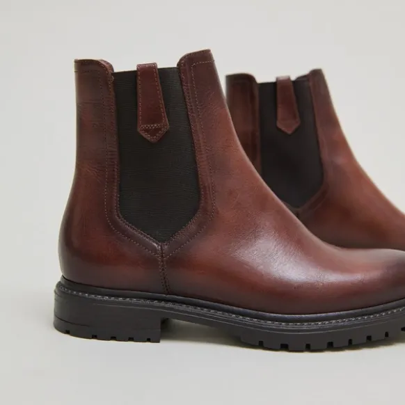 Bottines à semelles crantées et élastiques