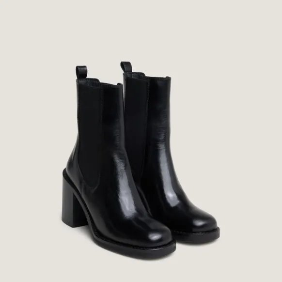 Bottines à talons débordants